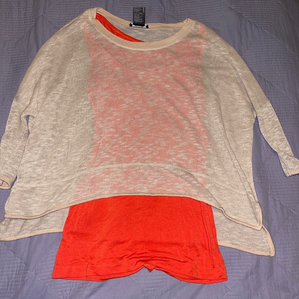 A cute layered tank with a net type shirt.